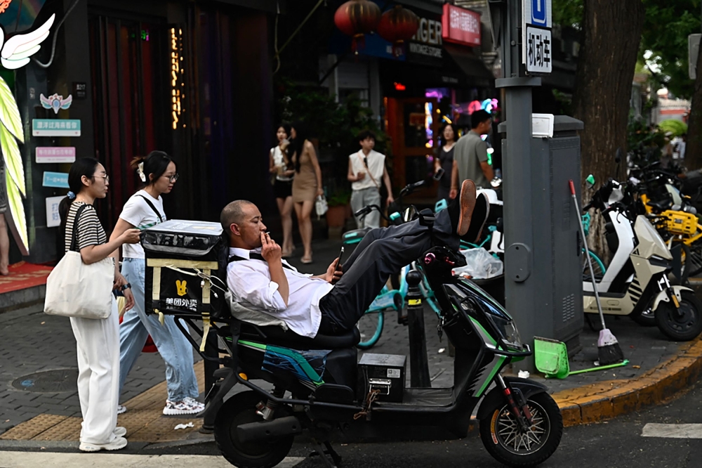 Chinese industrial production growth slowed in July while unemployment rose, official data showed today. — AFP pic