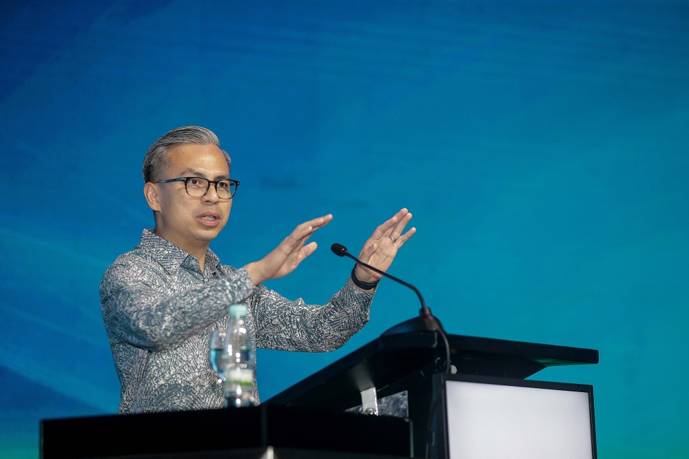 Communications Minister Fahmi Fadzil delivers a keynote at the Malaysia International Trade and Exhibition Centre. — Picture by Sayuti Zainudin