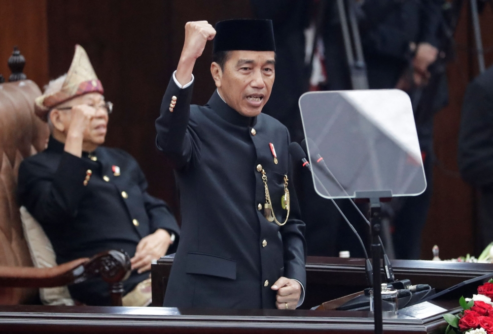 Indonesian President Joko Widodo gestures as he delivers his annual State of the Nation Address, ahead of the country's Independence Day, in Jakarta August 16, 2024. — Bagus Indahono/Pool pic via Reuters 