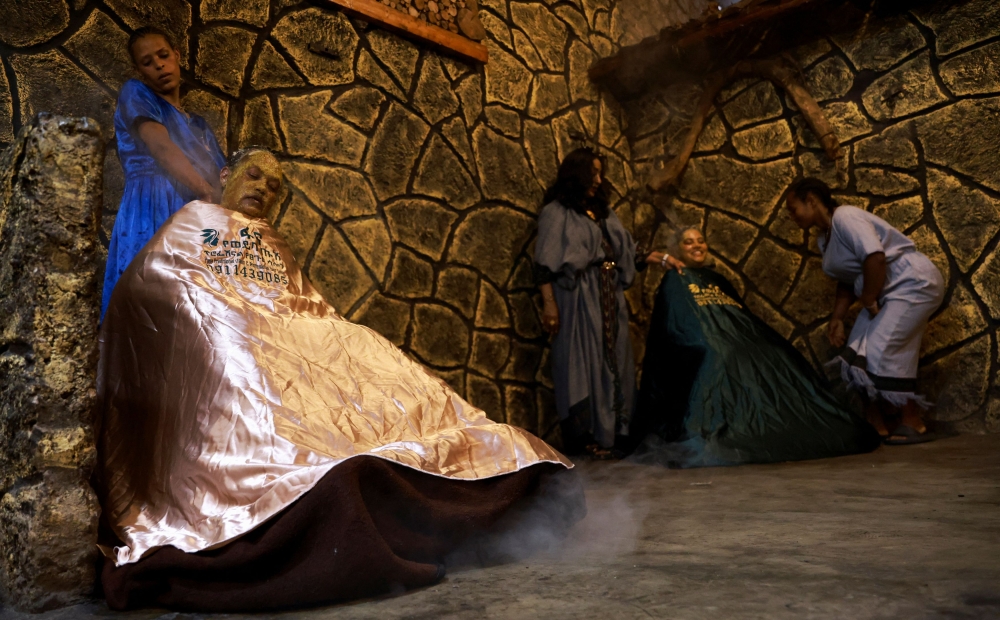 Women attend a traditions beauty session at the Fana 