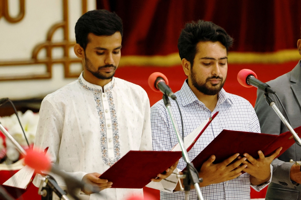 Asif Mahmud (left) and Nahid Islam (right), two student leaders are sworn in as the advisors of the newly formed interim government, at the Bangabhaban, in Dhaka, Bangladesh, August 8, 2024. — Reuters pic