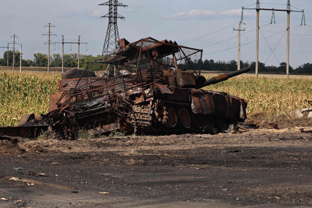 This photograph taken on 16 August, 2024, during a media tour organised by Ukraine, shows a destroyed Russian tank outside Ukrainian-controlled Russian town of Sudzha, Kursk region, amid the Russian invasion in Ukraine. — AFP pic
