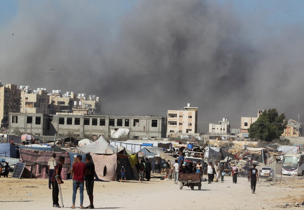 Smoke rises following an Israeli strike on a residential building, amid the ongoing conflict between Israel and Hamas, in Khan Younis, in the southern Gaza Strip, August 16, 2024.  — Reuters pic  