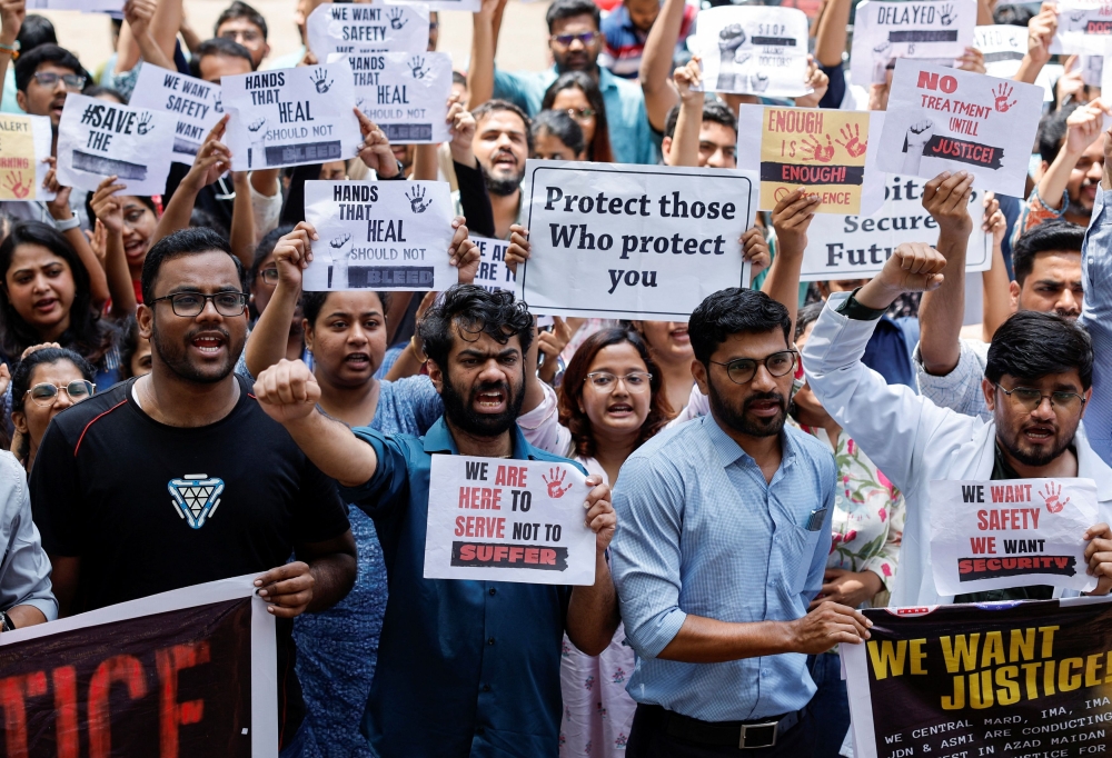 Medical staff shout slogans while holding placards during a protest at a hospital in Mumbai, after a nationwide strike was declared by the Indian Medical Association to protest the rape and murder of a trainee medic at a government-run hospital in Kolkata August 17, 2024. — Reuters pic  