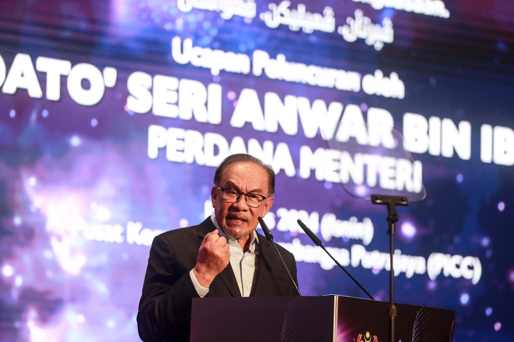 Prime Minister Datuk Seri Anwar Ibrahim delivers his speech during the launch of the Bumiputera Economic Transformation Plan 2035 at the Putrajaya International Convention Centre, August 19, 2024. — Picture by Sayuti Zainudin