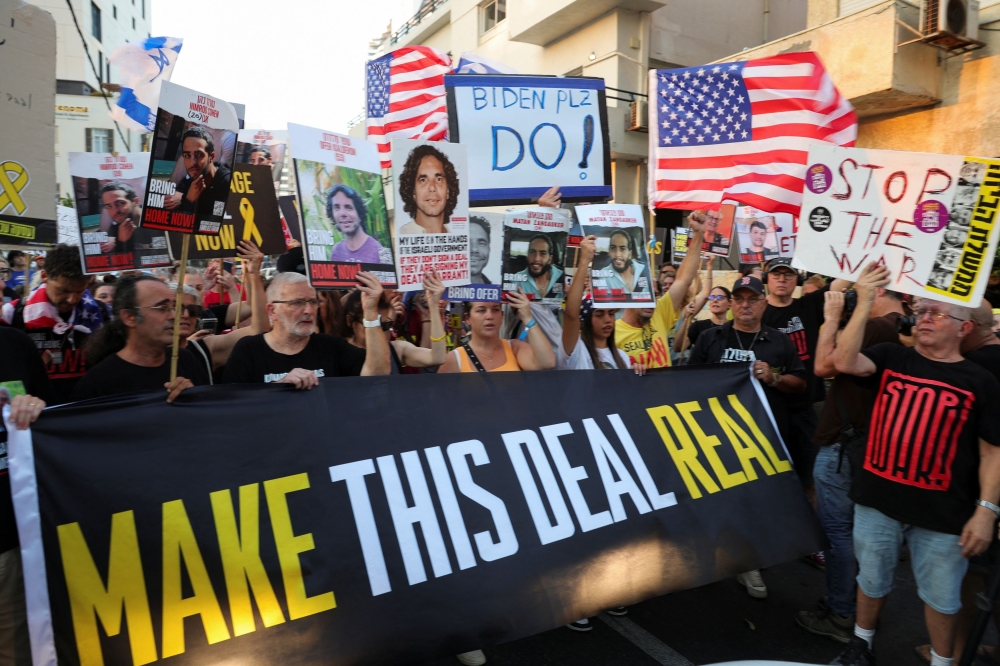 Supporters of hostages who were kidnapped during the deadly October 7 attack, demand their immediate release, during a protest outside a press event attended by U.S. Secretary of State Blinken, in Tel Aviv, Israel, August 19, 2024. — Reuters