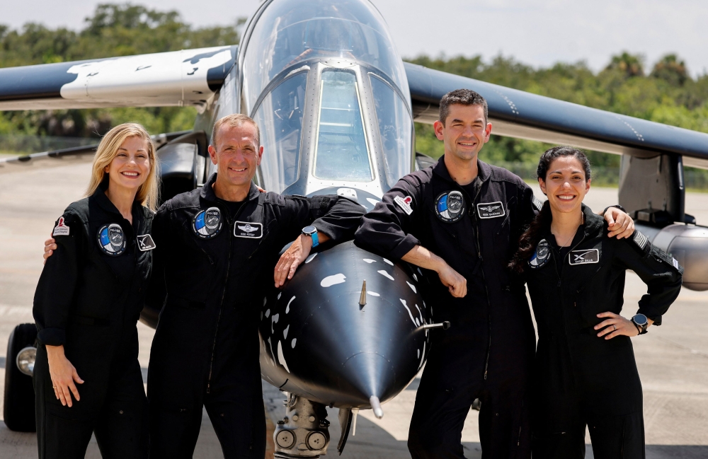 Anna Menon, Scott Poteet, commander Jared Isaacman and Sarah Gillis, crew members of Polaris Dawn, a private human spaceflight mission, attend a press conference at the Kennedy Space Center in Cape Canaveral, Florida, U.S. August 19, 2024. Launch aboard a SpaceX Falcon 9 rocket is scheduled for August 26. — Reuters pic