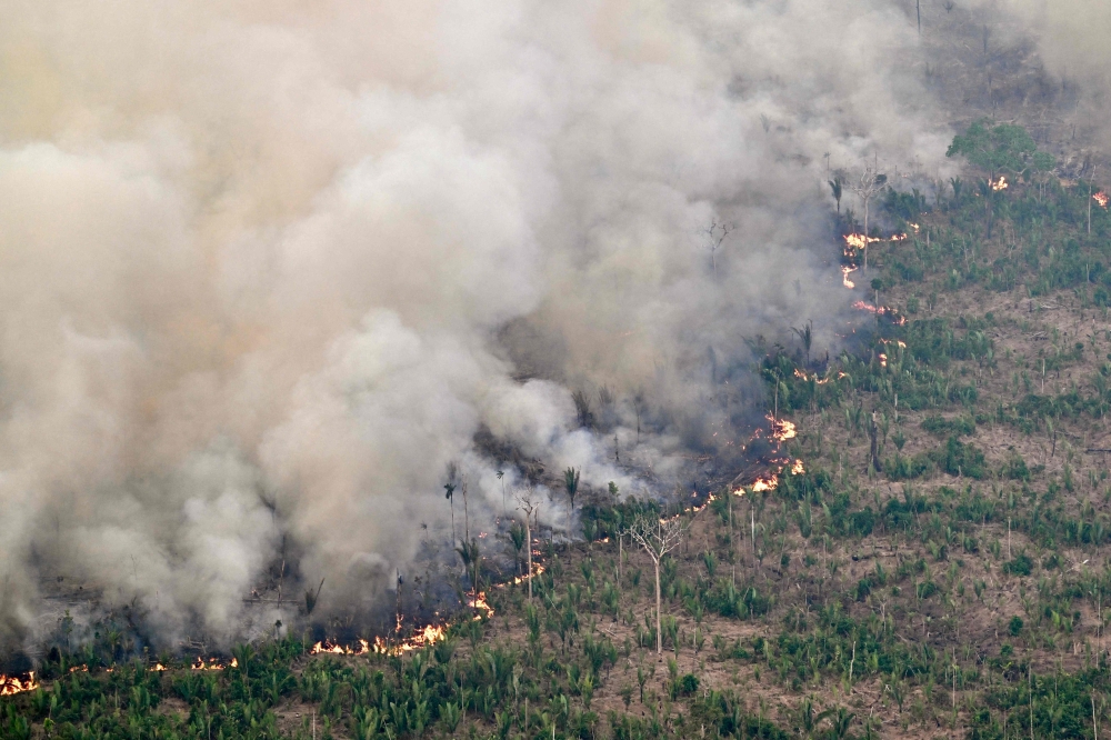 Aerial view of an area of Amazon rainforest deforested by illegal fire in the municipality of Labrea, Amazonas State, Brazil on August 20, 2024.?. Residents of Porto Velho in the Brazilian Amazon have barely seen sunlight in days as a thick cloud of smoke from forest fires envelops their city. — AFP pic