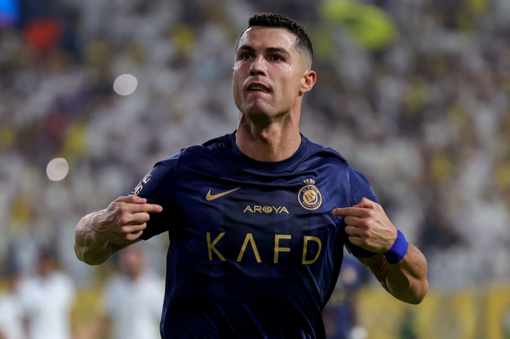 Cristiano Ronaldo celebrated his 850th career goal as Al Nassr won 5-1 at Al-Hazm in the Saudi Pro League. — AFP pic