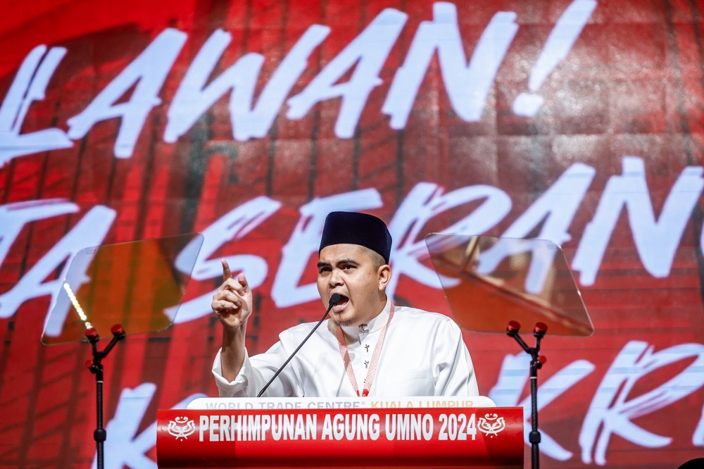Umno Youth chief Dr Muhamad Akmal Saleh speaks at the Umno Youth wing's general assembly at the World Trade Centre Kuala Lumpur August 22, 2024. — Picture by Firdaus Latif