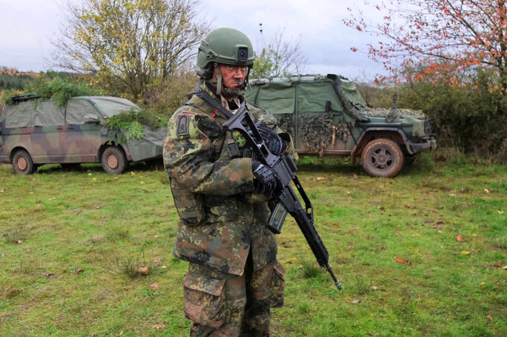 A member of the Nato Response Force (NRF) from the German armed forces Bundeswehr holds a weapon at the shooting range of Baumholder near Kaiserslautern, Germany, November 17, 2022. — Reuters pic  
