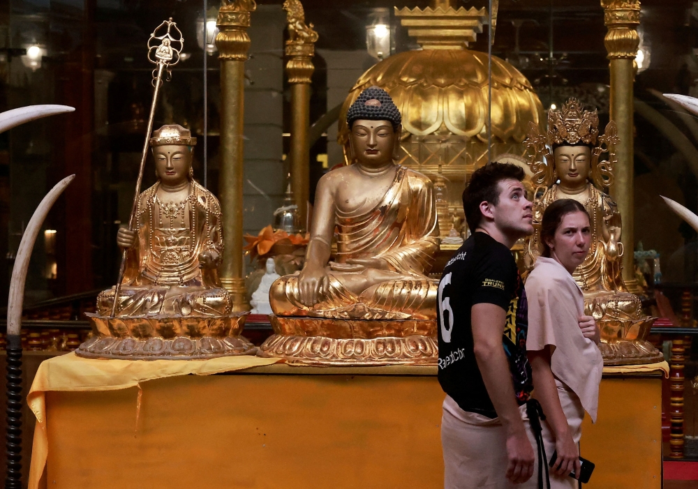 Tourists visit Gangaramaya Buddhist temple in Colombo April 25,2024. — Reuters pic  