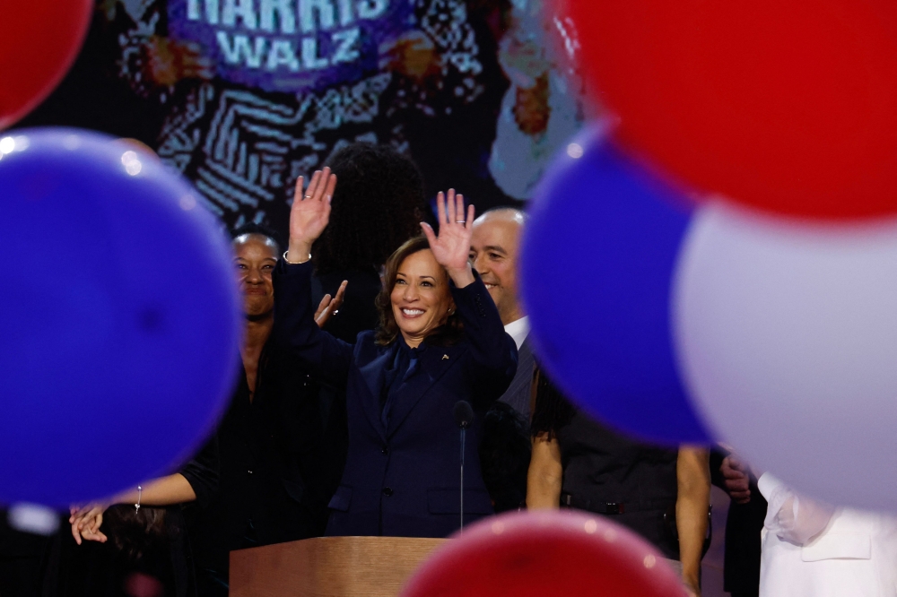 Democratic presidential nominee, U.S. Vice President Kamala Harris celebrates after accepting the Democratic presidential nomination during the final day of the Democratic National Convention at the United Center on August 22, 2024 in Chicago, Illinois. — AFP pic