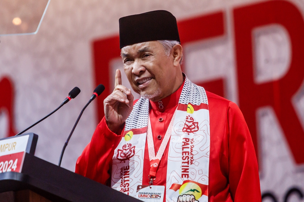Umno president Datuk Seri Ahmad Zahid Hamidi delivers his opening speech during the 2024 Umno General Assembly at the World Trade Centre Kuala Lumpur August 23, 2024. — Picture by Firdaus Latif