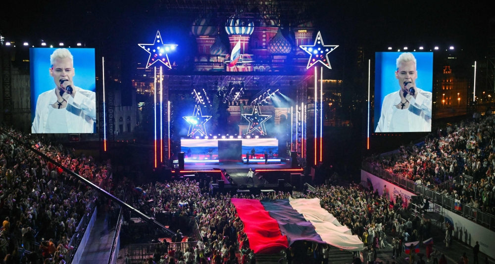 Pro-Kremlin Russian pop idol Shaman (Yaroslav Dronov), dressed in the colours of the national flag, gives a concert on Red Square on Flag Day in Moscow August 22, 2024. — AFP pic
