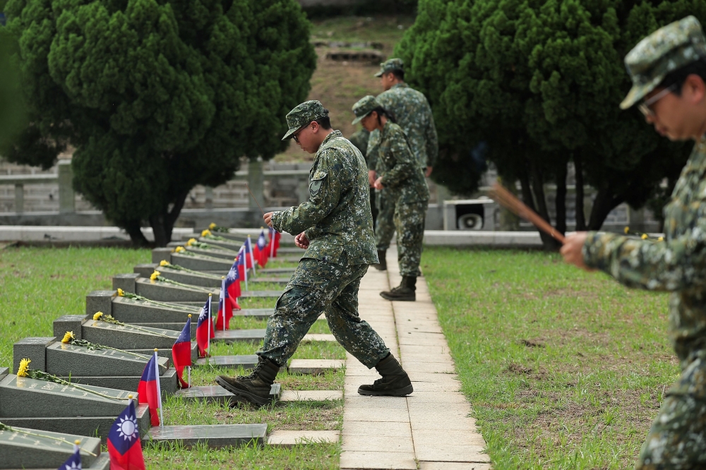 Soldiers pay their respect at a ceremony commemorating the war against Chinese forces on the frontline island in Kinmen, Taiwan August 23, 2024. — Reuters pic