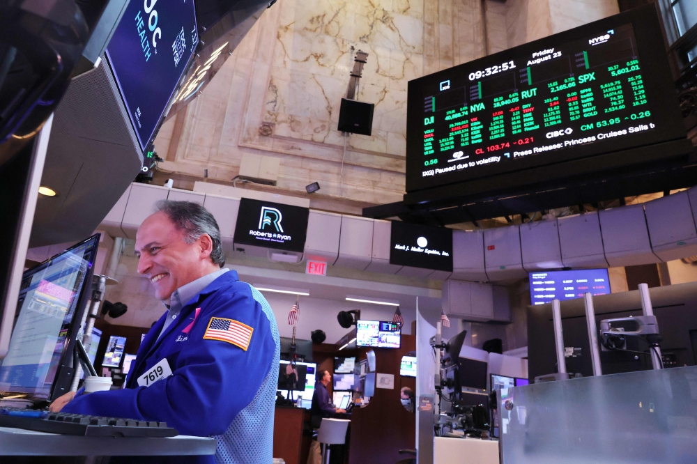 US stocks rose following Powell’s remarks, with all three major indices on Wall Street ending the day up by at least 1.1 per cent. — AFP pic