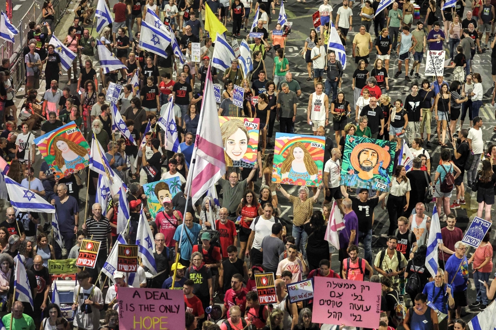This overview shows a demonstration demanding action to free the Israeli hostages held captive in the Gaza Strip since the October 7 attacks by Palestinian militants, outside the Defence Ministry headquarters in Tel Aviv on August 24, 2024. — AFP pic