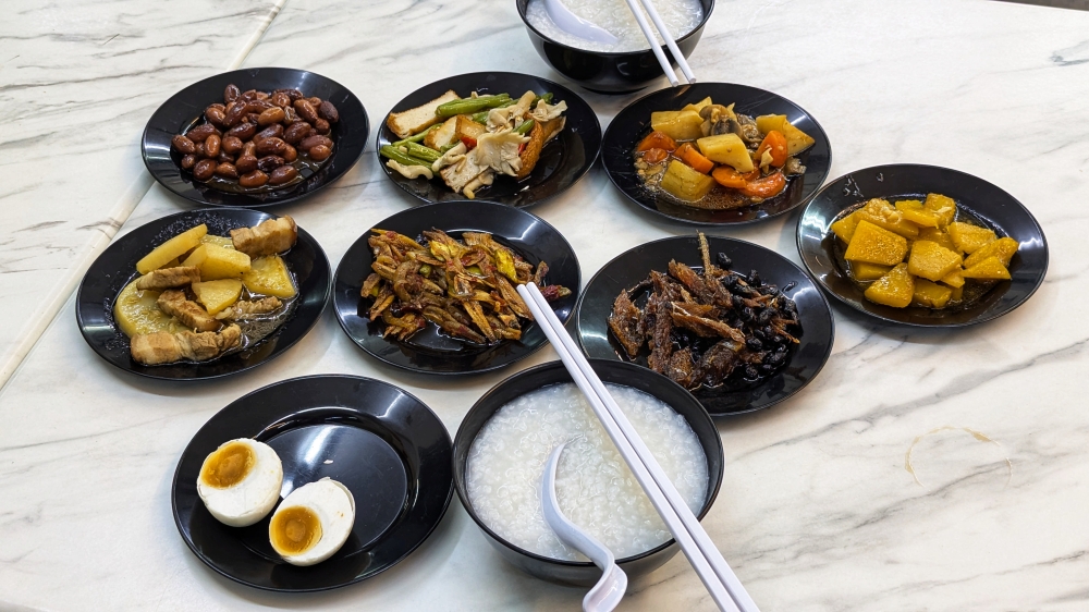 The spread of Teochew porridge and accompanying dishes at 9 Hao Restaurant & Cafe. — Picture by Ethan Lau