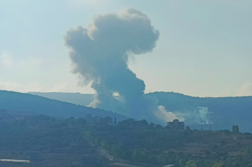 Smoke billows from an area targeted by an Israeli airstrike between the southern Lebanese border villages of Zibqin and Yater today. — AFP pic