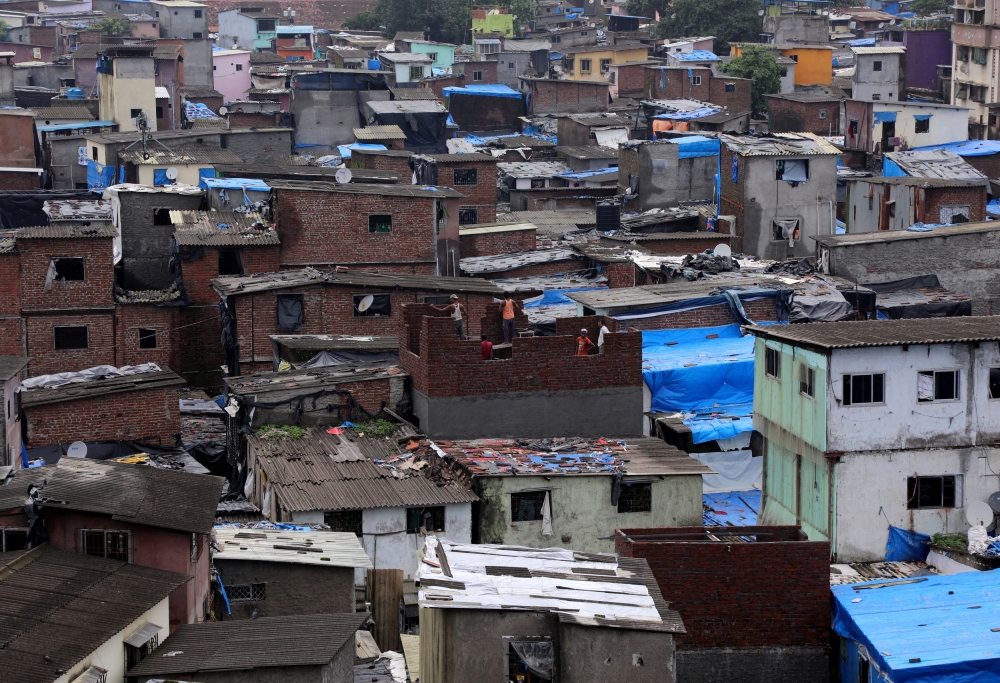 File photograph showing labourers building a structure in Dharavi, one of Asia’s largest slums, in Mumbai, India on August 1, 2023. — Reuters pic