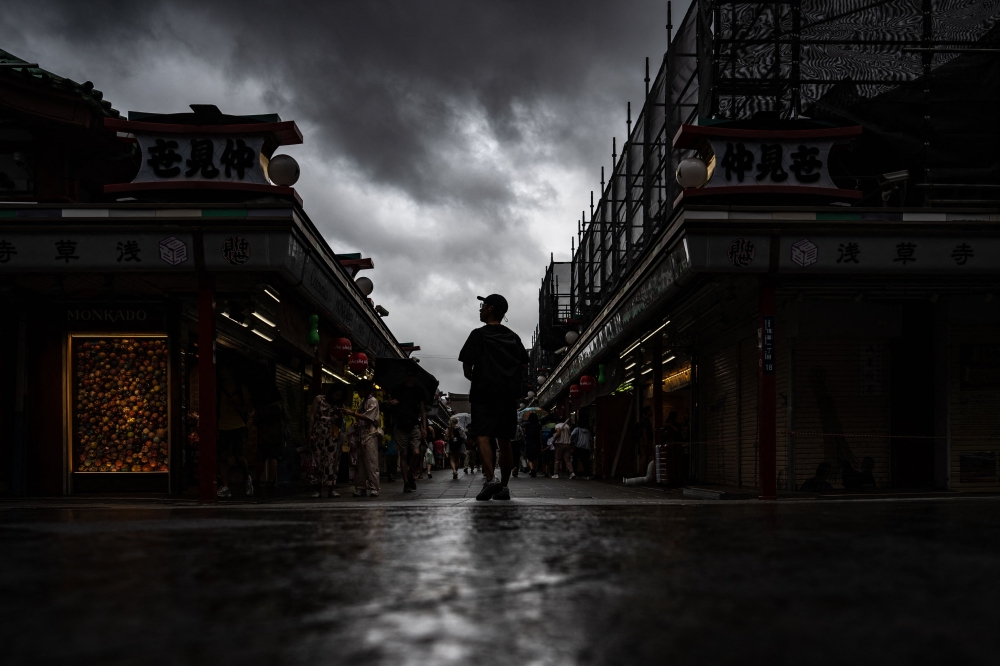 People visit Sensoji temple in Tokyo's Asakusa district on August 16, 2024, as Typhoon Ampil barrels towards Japan's capital. — AFP pic