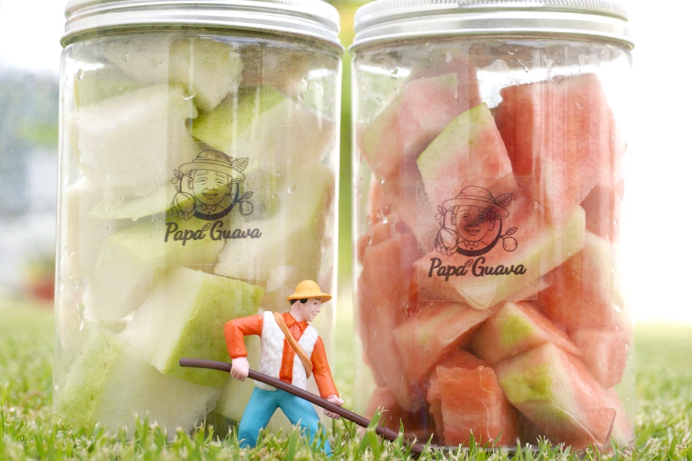 Jars of PapaGuava’s freshly cut green and pink guava. — Picture courtesy of PapaGuava