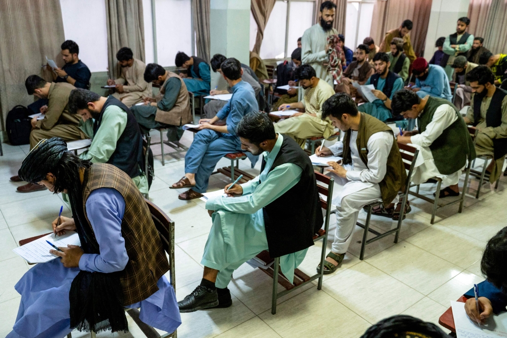 In this photo taken on July 22, 2024, male students attend a mid-term examination at a private university in Kabul, Afghanistan. — AFP pic