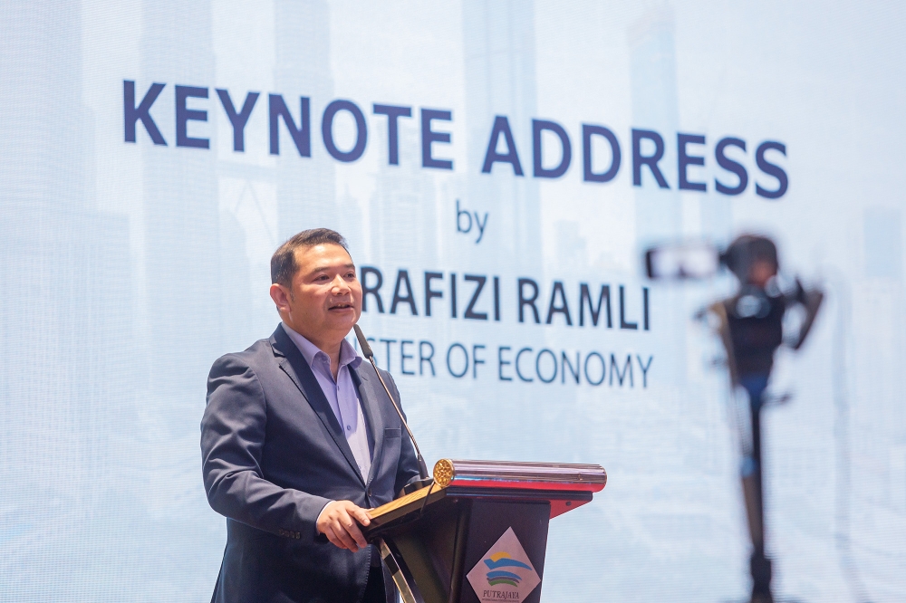 Economy Minister Rafizi Ramli speaks at the 2024 OECD Economic Surveys Malaysia at the Putrajaya International Convention Centre on August 27, 2024. — Picture by Firdaus Latif