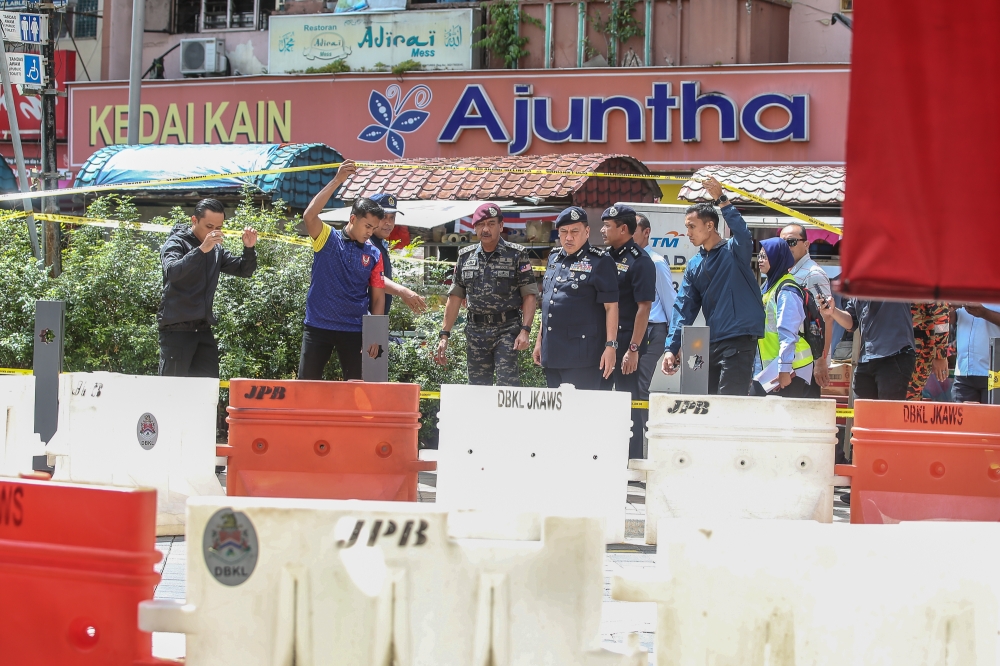 Inspector General of Police Tan Sri Razarudin Husain visits the site of the second sinkhole at Jalan Masjid India in Kuala Lumpur August 28, 2024. — Picture by Yusof Mat Isa