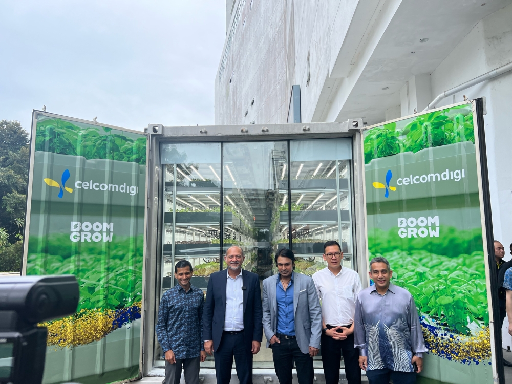 Digital Minister Gobind Singh (second from left) at the launch of the collaboration between BoomGrow and CelcomDigi. — Picture by Opalyn Mok