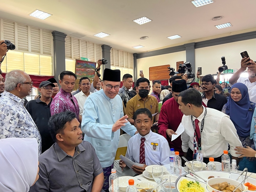 Prime Minister Datuk Seri Anwar Ibrahim speaks to students during his visit to the BM High School in Penang August 30, 2024. — Picture by Opalyn Mok