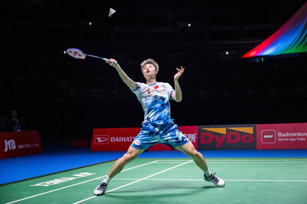 China's Shi Yuqi hits a return against France? Alex Lanier during their men's singles semi-final on day five of the Japan Open badminton tournament at Yokohama Arena in Yokohama, Kanagawa prefecture, south of Tokyo on August 24, 2024. — AFP pic