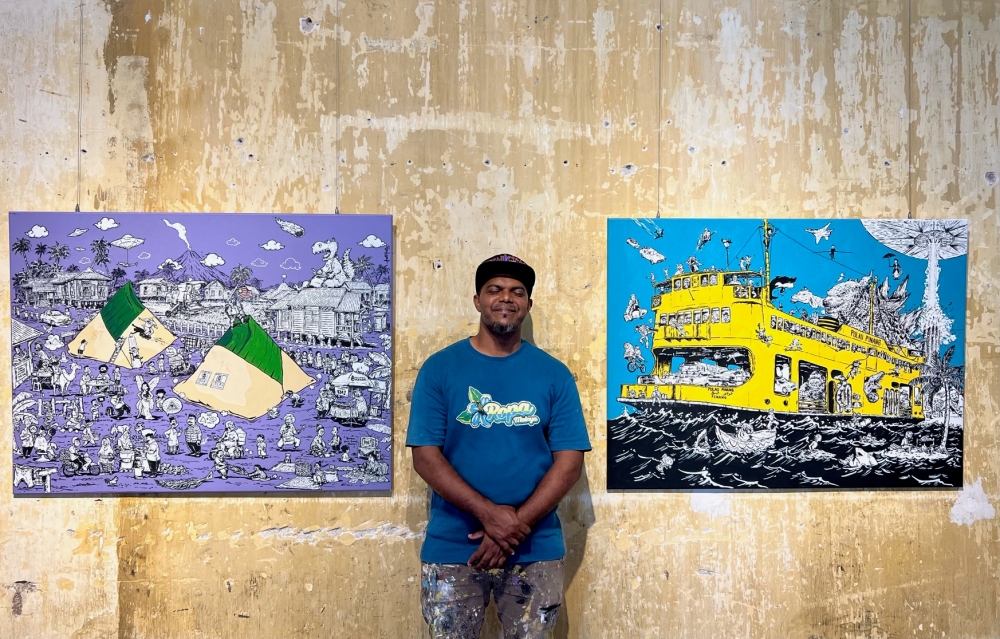 Azmi Hussin with ‘Kampung Nasi Lemak’ (left) and ‘Ferry To Hollywood’ (right). — Picture by Opalyn Mok 