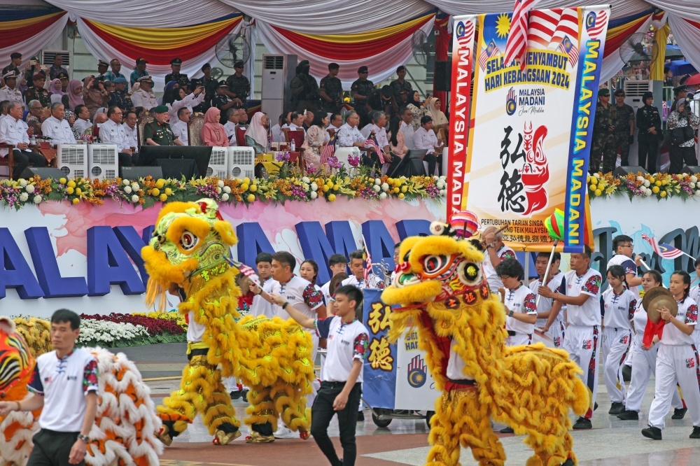 The Chingay procession marches past the grandstand for the 2024 National Day Parade in Putrajaya, on August 31, 2024. — Bernama pic