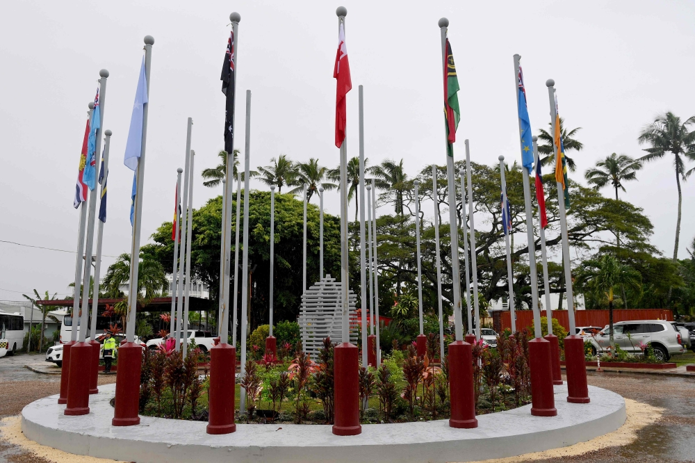 This handout photo taken and released on August 26, 2024 by the European Commission shows flags of the Pacific Islands Forum member nations outside the convention centre during the Pacific Islands Forum meeting in Nuku’alofa. — Izhar Khan/European Commission/AFP) 