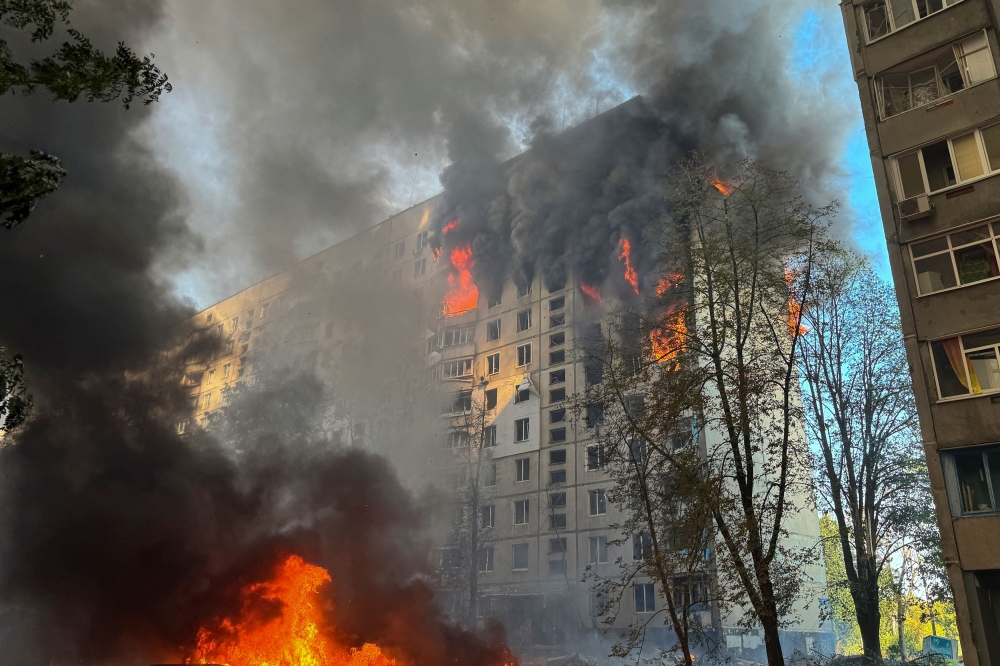 A view shows a burning apartment building hit by a Russian air strike, amid Russia's attack on Ukraine, in Kharkiv, Ukraine August 30, 2024. — AFP pic