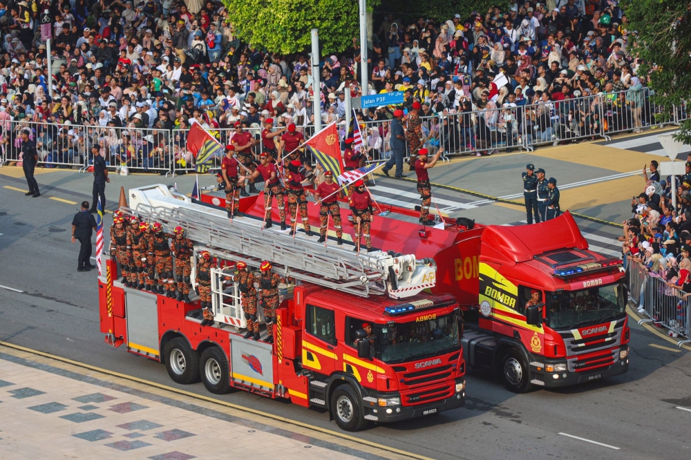The Fire and Rescue Department personnel seen during the Merdeka parade at Dataran Putrajaya today. — Bernama pic