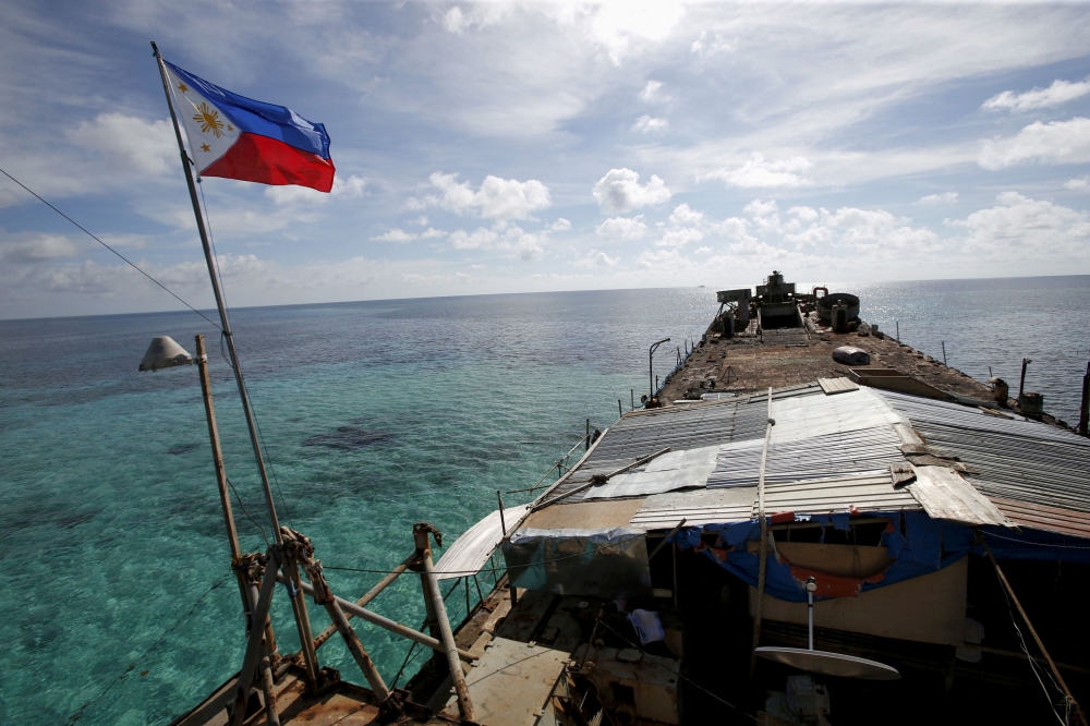 A Philippine flag flutters from BRP Sierra Madre, a dilapidated Philippine Navy ship that has been aground since 1999 and became a Philippine military detachment on the disputed Second Thomas Shoal, part of the Spratly Islands, in the South China Sea. China and the Philippines accused each other of ramming their ships in a disputed area of the South China Sea today. — Reuters pic