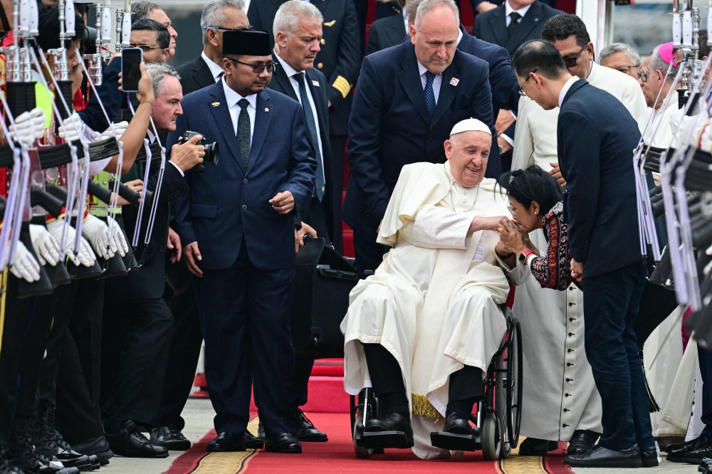 Pope Francis arrived in Muslim-majority Indonesia on September 3 for the first stop of a four-nation tour in the Asia-Pacific that will be the longest of the 87-year-old's papacy, according to an AFP reporter travelling with him. — AFP pic