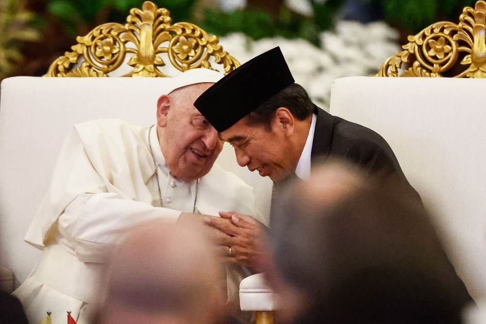 Pope Francis and Indonesia’s President Joko Widodo attend a meeting with Indonesian authorities, civil society and the diplomatic corps at the Presidential Palace in Jakarta September 4, 2024, during his apostolic visit to Asia. — AFP pic