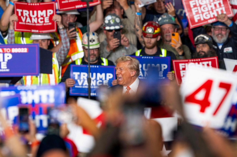 Former US President and Republican presidential candidate Donald Trump reacts as he arrives for a rally at 1st Summit Arena at the Cambria County War Memorial in Johnstown, Pennsylvania, on August 30, 2024. — AFP pic 