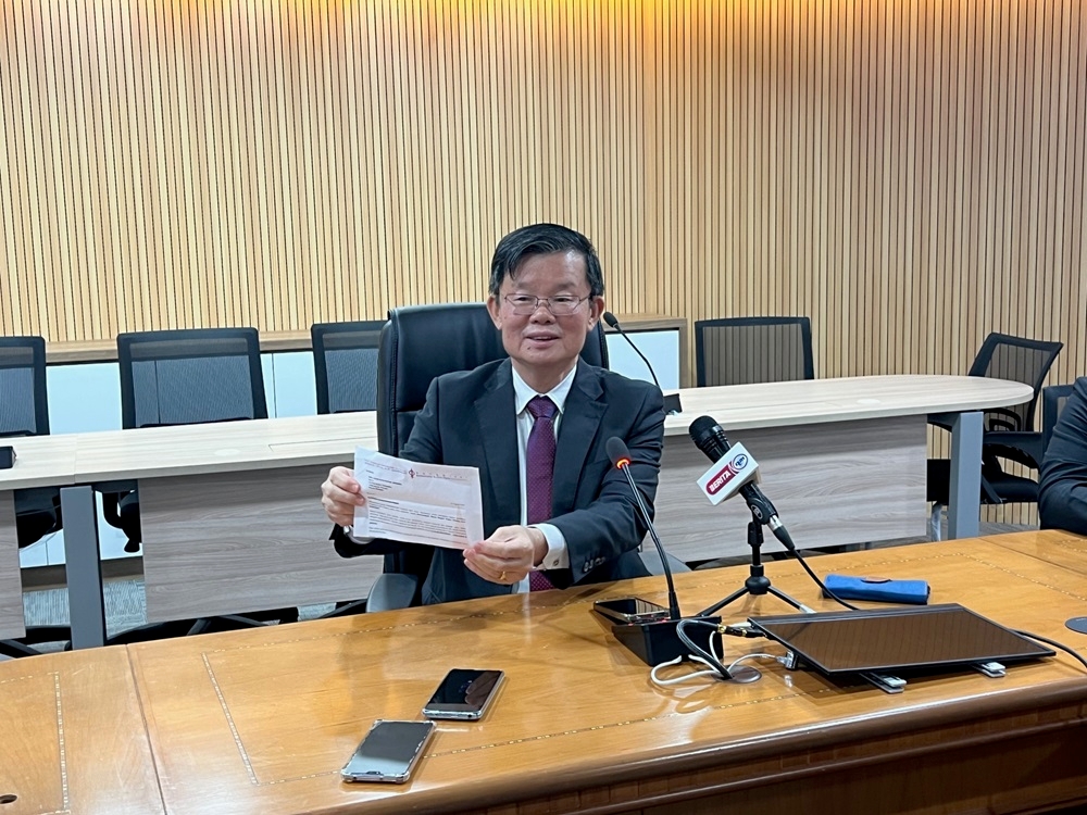 Penang DAP chairman Chow Kon Yeow holds a letter from the party dated August 27 saying that he was nominated to contest in the state party elections on September 22. — Picture by Opalyn Mok