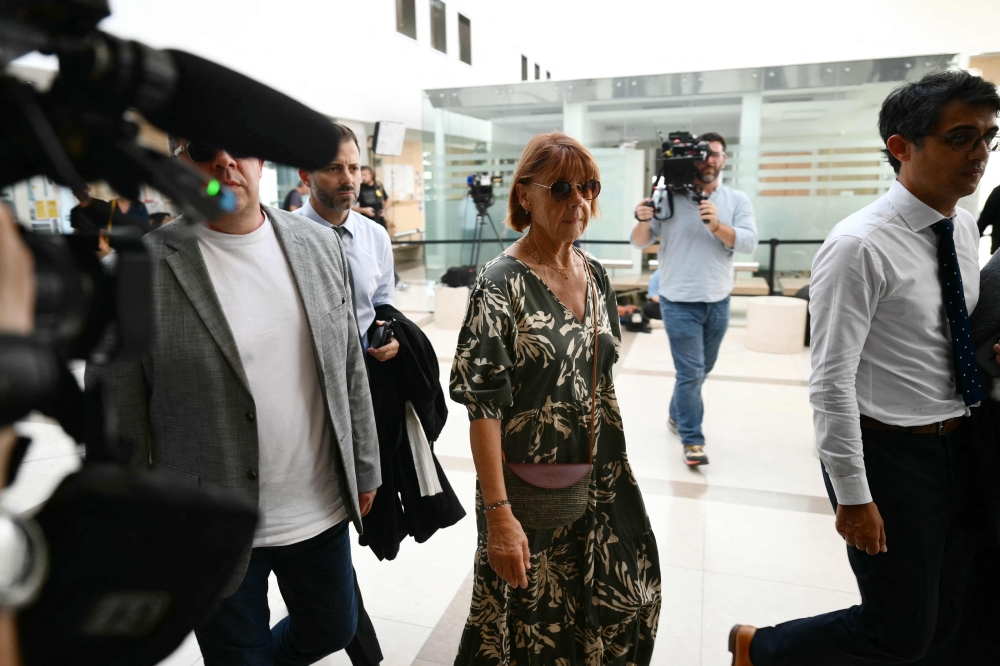 The rape against Gisele P. (centre) involves 50 co-defendants. The defendants, 18 of whom are on remand, are men aged between 21 and 68 at the time of the events. — AFP pic