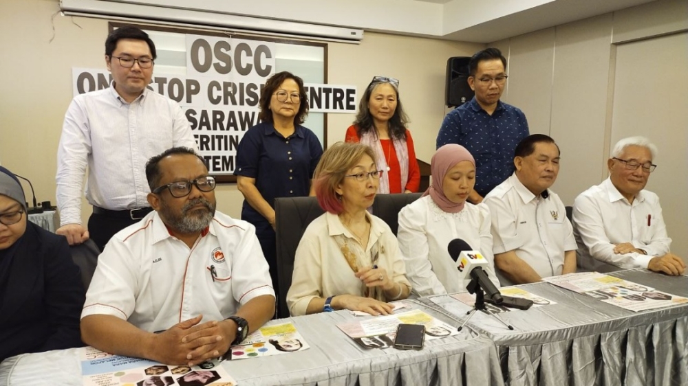 One Stop Crisis Centre chairwoman Datuk Lily Yong (seated, 2nd left) speaks to the press, flanked by Sarawak Health Department deputy director Dr Azlee Ayub and Legal Aid Department Sarawak director Zubaidah Sharkawi (3rd right). — The Borneo Post pic 