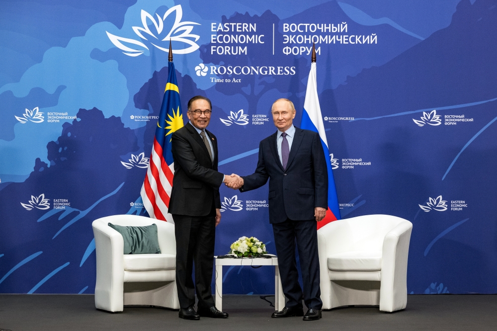 Prime Minister Datuk Seri Anwar Ibrahim shakes hands with Russian president Vladimir Putin during the 9th Eastern Economic Forum (EEF) in Vladivostok September 4, 2024. — Bernama pic