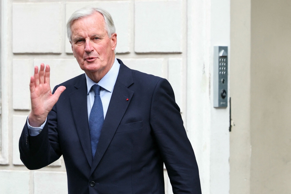 France’s new Prime Minister Michel Barnier gestures before the handover ceremony at the Hotel Matignon in Paris, on September 5, 2024. — AFP pic