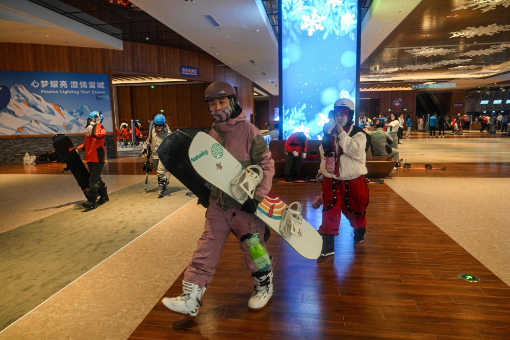 People seek relief indoors at the L*SNOW Indoor Skiing Theme Resort in Shanghai after China’s hottest August since 1961. — AFP pic