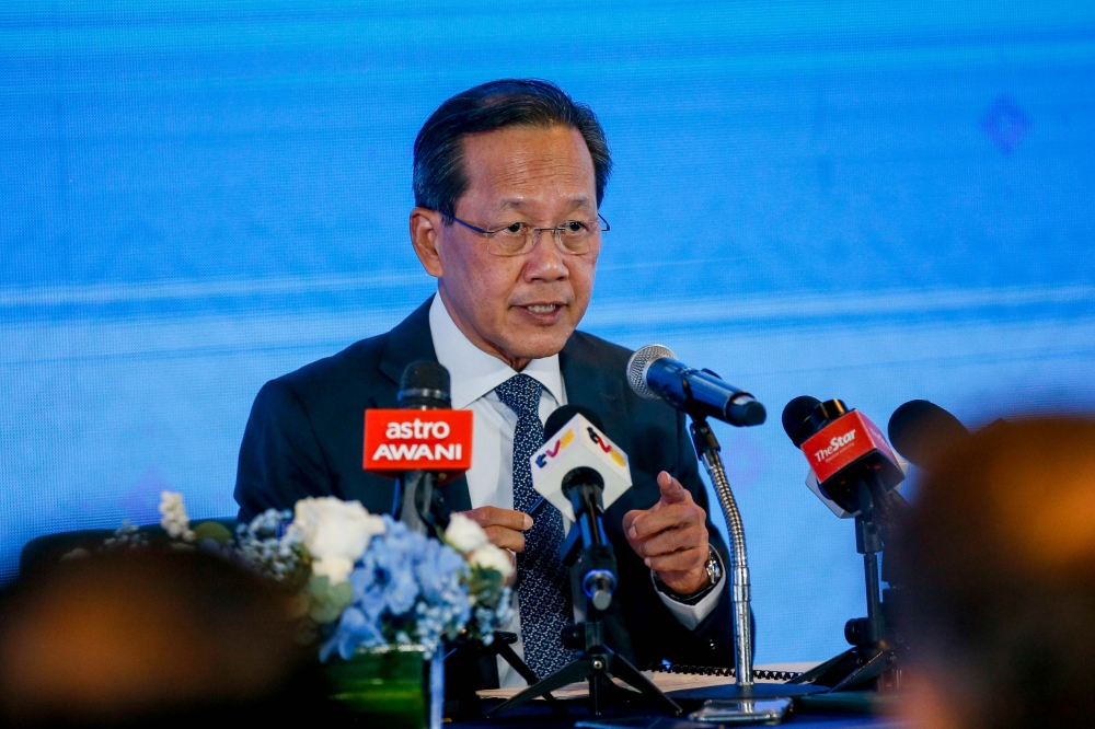 Datuk Captain Izham Ismail, Group Managing Director of Malaysia Aviation Group speaking to the media during press event announcing a new route to Paris at MITEC, Kuala Lumpur.September 06,2024. — Picture by Raymond Manuel