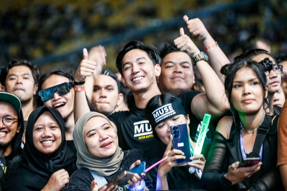 Fans of British alternative rock band MUSE during a live concert at Stadium Bukit Jalil Kuala Lumpur, July 29, 2023. Recent data reveals that a growing number are warming up to the idea of a female prime minister and are in favour of more concerts, despite mixed gender crowds. — Picture by Hari Anggara